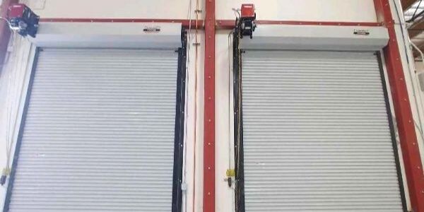 Inside view of two commercial roll up doors recently repaired and services by our top overhead door company near Ventura Heights, Ventura.